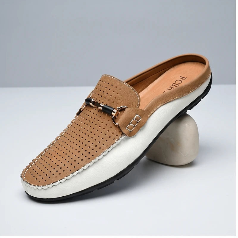 Khaki leather loafers in a studio background