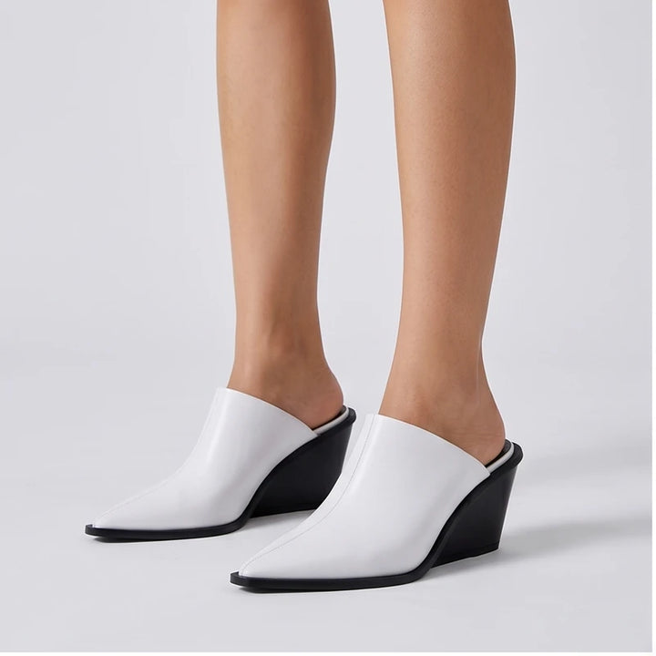 Model wearing White cowhide Valdis Genuine Leather Wedge Mules in studio