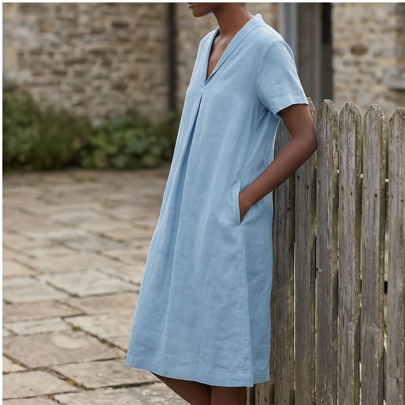 Model wearing Blue Women's Short-sleeved Cotton and Linen Dress V-neck Loose Large Size Casual Vacation Street Long Dress with Pockets outdoors - 3
