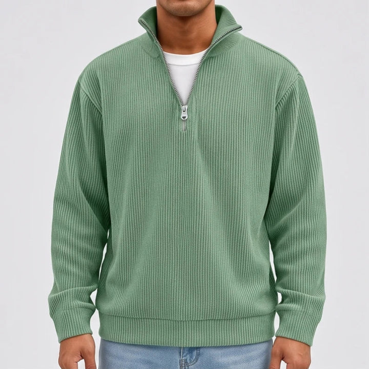 Model wearing Green corduroy pullover in a studio