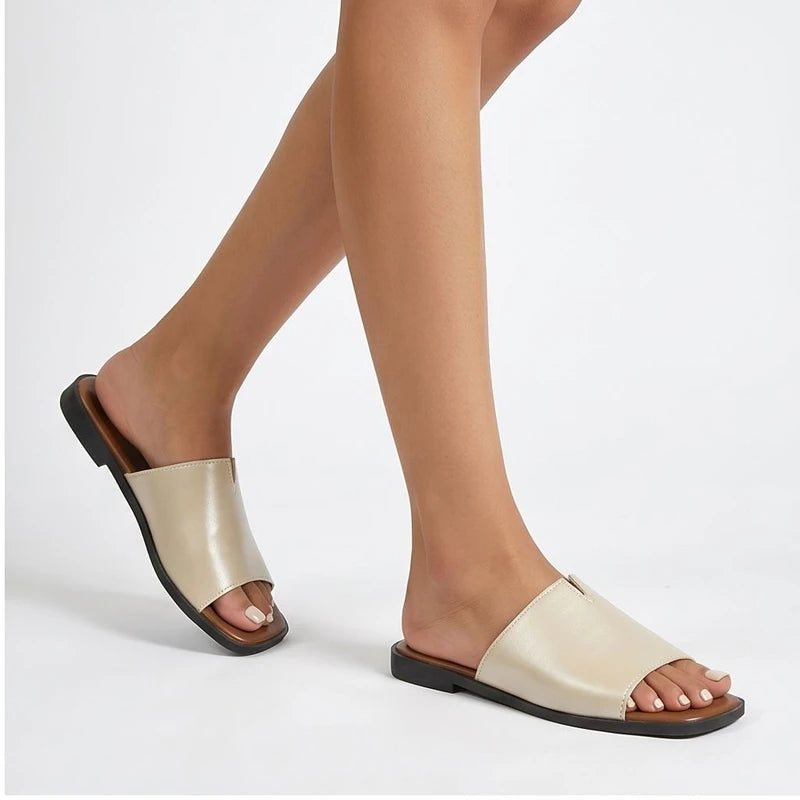 Model wearing Beige Shiny Metallic Flat Slides for Women Square Toe Open Toe Lightweight Comfortable Summer Beach Casual Daily Walking Shoes in studio - 2