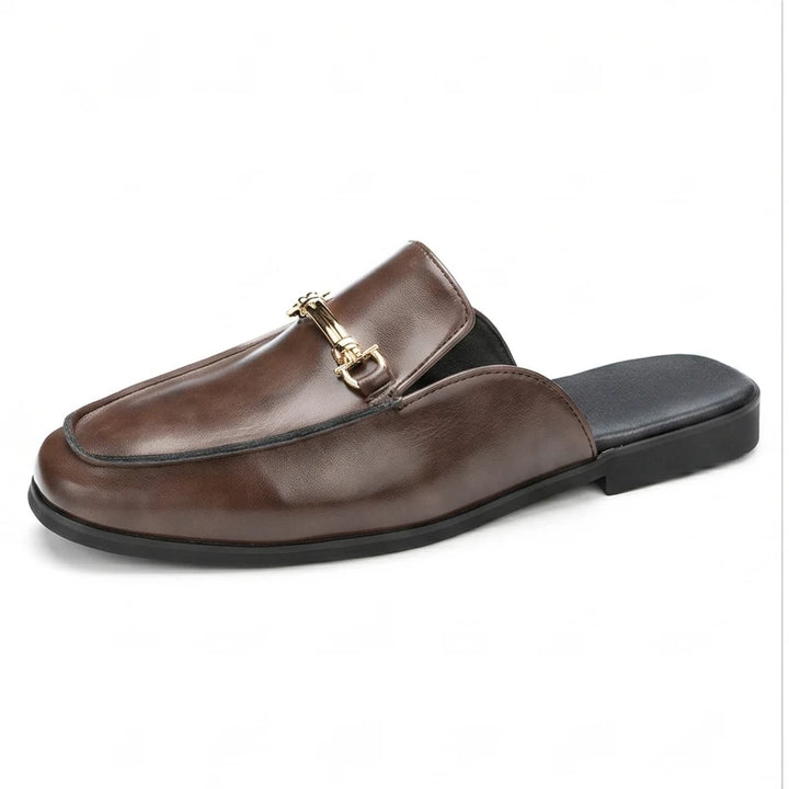 Brown leather loafers on a white background