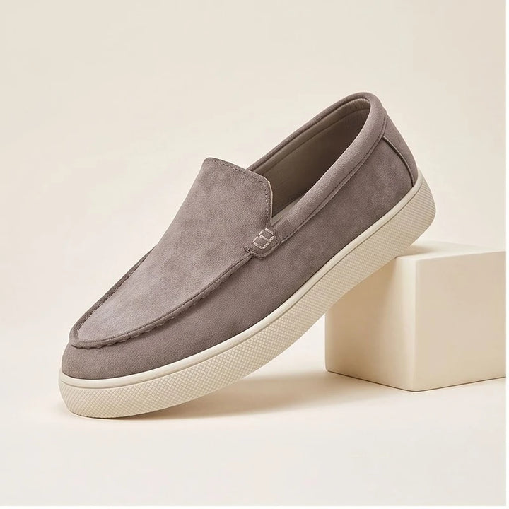 brown1 suede loafers in a studio background