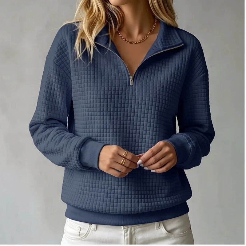 Model wearing Navy Blue knit pullover in a studio