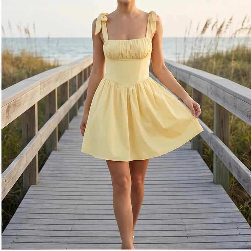 Model wearing S Solara Tie-Strap Yellow Mini Dress outdoors - 2