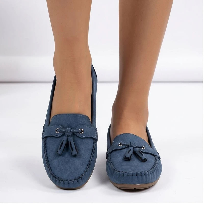Model wearing Blue loafers in a studio