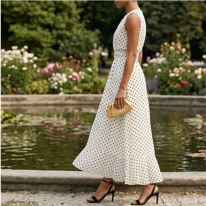 Model wearing White Sleeveless Polka Dot Chiffon Maxi Dress with Ruffle Hem and Flowing A Line Silhouette for Summer Parties outdoors - 3