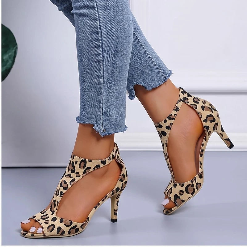 Model wearing Leopard sandals in a studio - 2