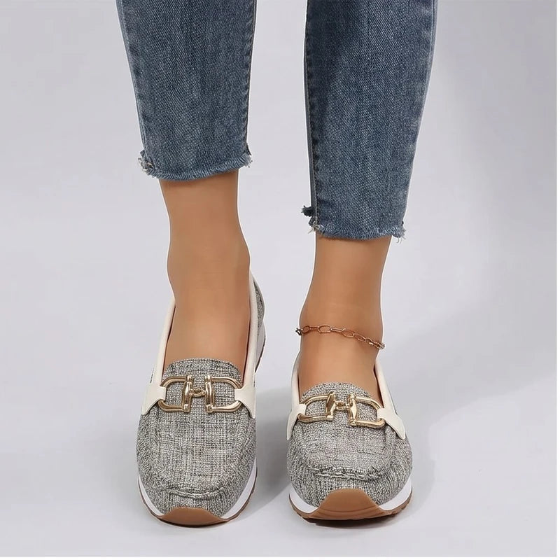Model wearing Beige metal flat in a studio