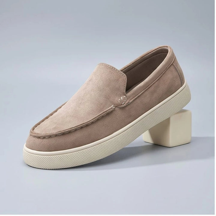 beige1 suede loafers in a studio background
