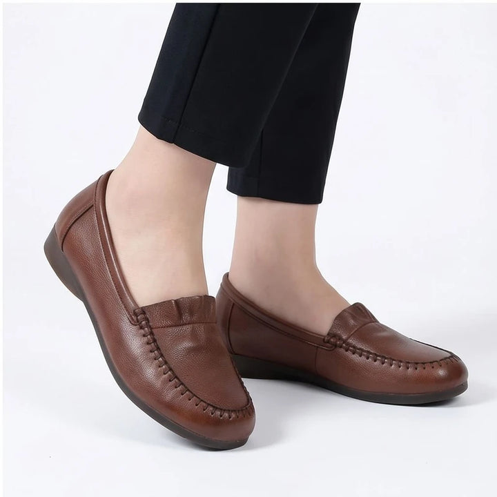 Model wearing Brown leather loafers in a studio - 3