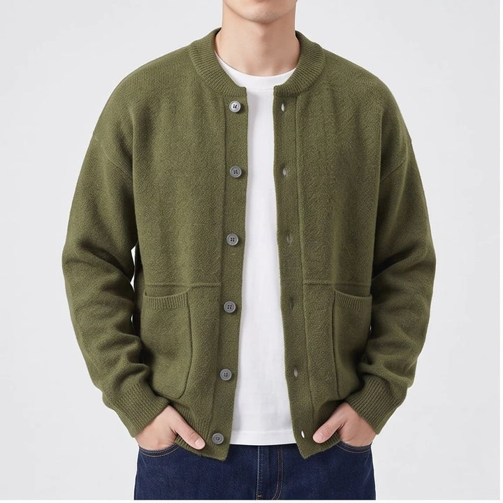 Model wearing Green knitted cardigan in a studio