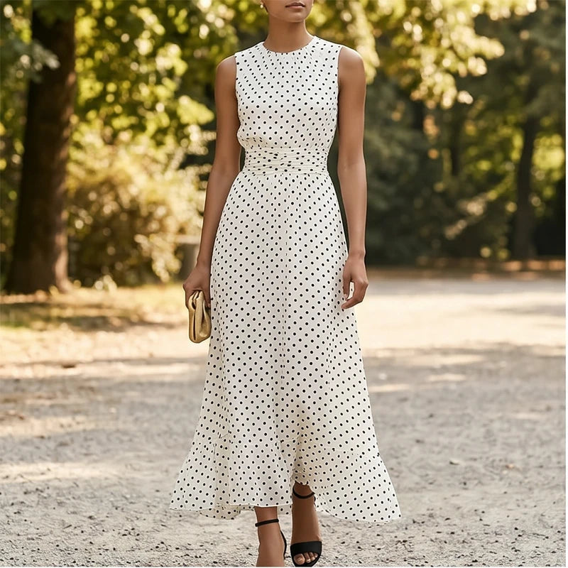 Model wearing White Sleeveless Polka Dot Chiffon Maxi Dress with Ruffle Hem and Flowing A Line Silhouette for Summer Parties outdoors