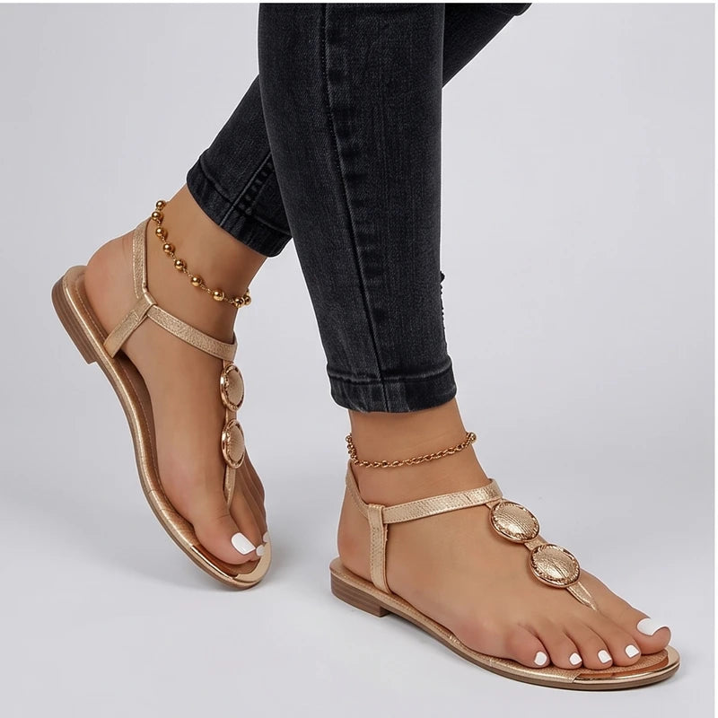 Model wearing Gold Harlow T-Strap Flat Sandals in studio - 3