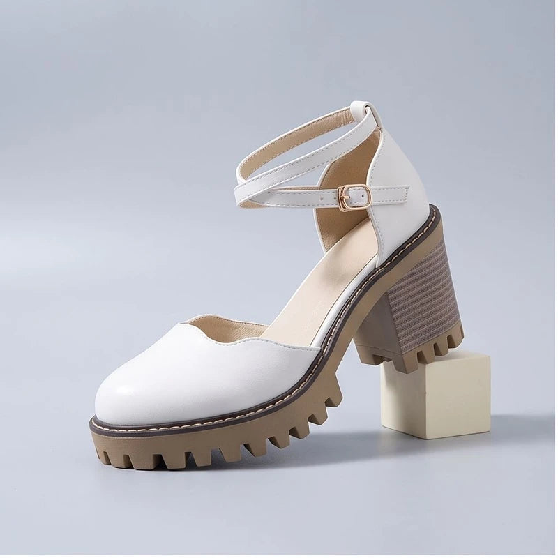 White heels in a studio background