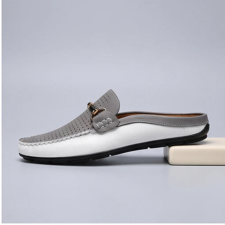 Gray leather loafers in a studio background - 2