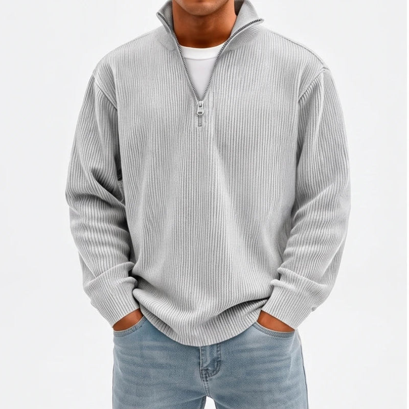 Model wearing Light Gray corduroy pullover in a studio