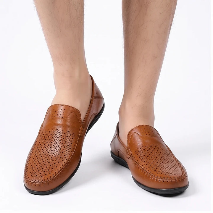 Model wearing Brown leather loafers in a studio