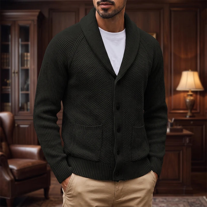 black knitted sweater in a dark wood interior