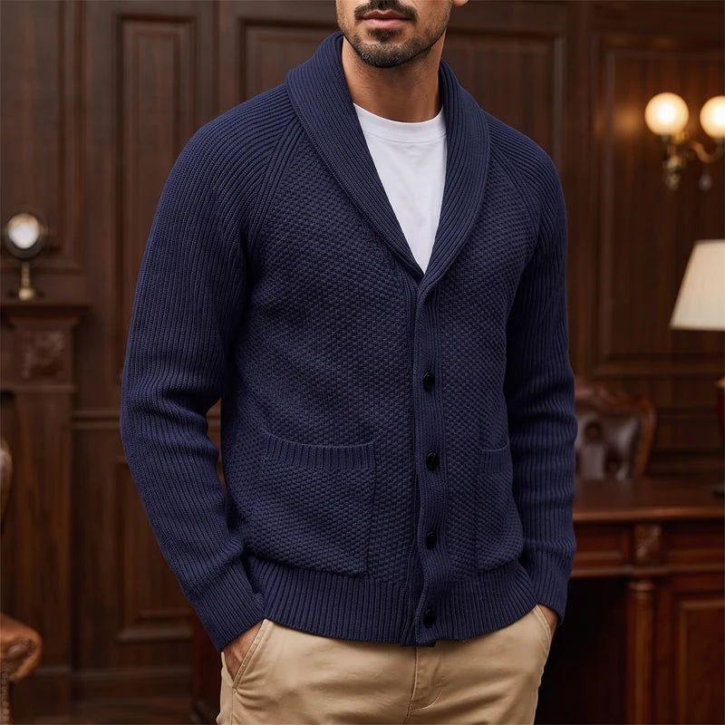 Dark Blue knitted sweater in a dark wood interior