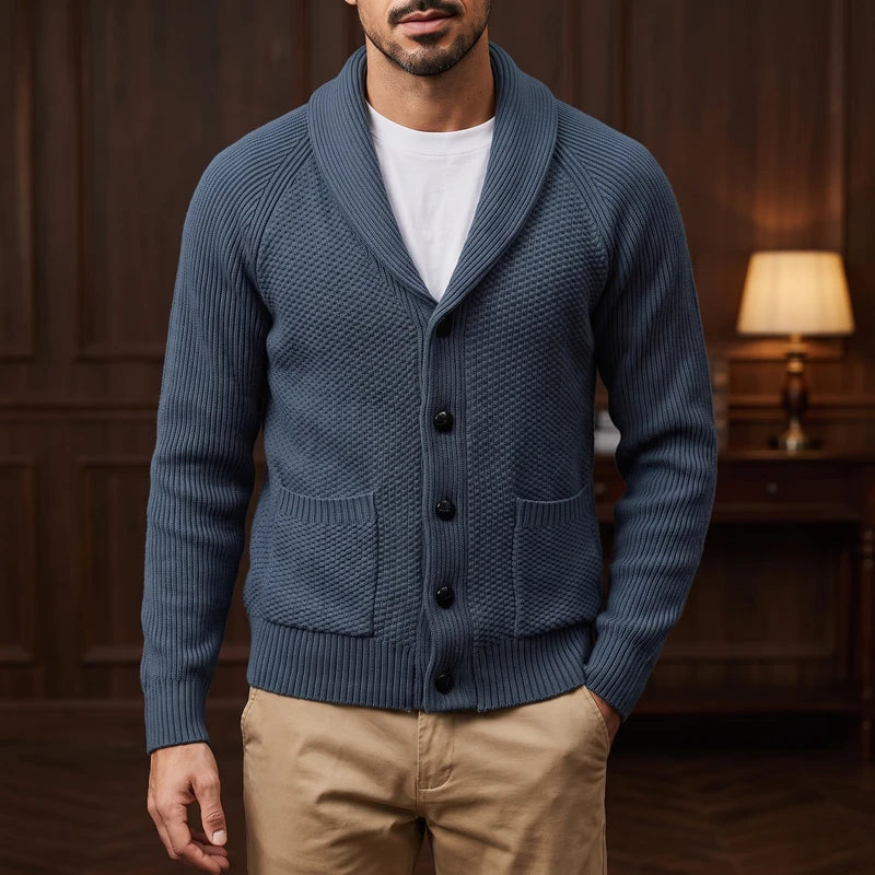 Gray Blue knitted sweater in a dark wood interior