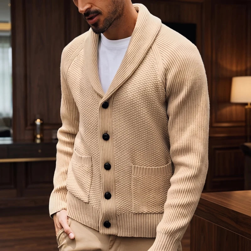 Khaki knitted sweater in a dark wood interior