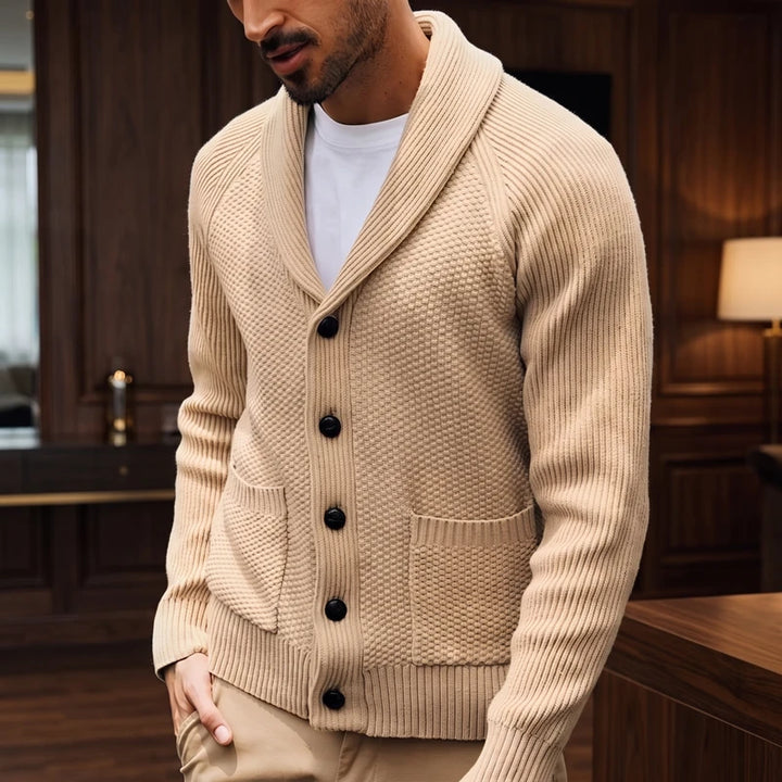 Khaki knitted sweater in a dark wood interior