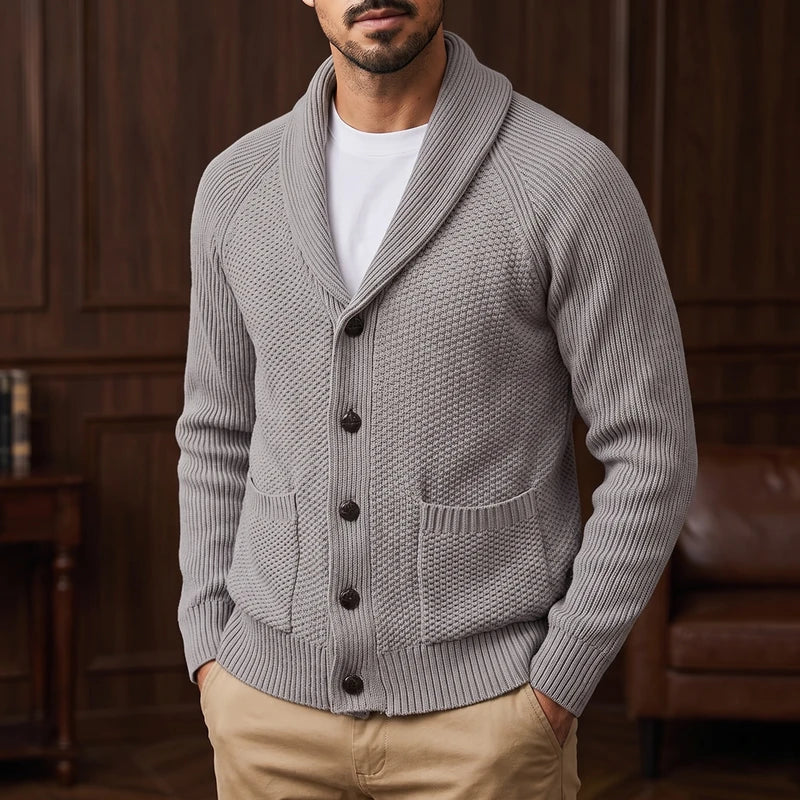 Light Grey knitted sweater in a dark wood interior