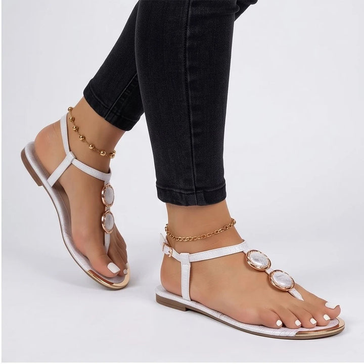 Model wearing White Harlow T-Strap Flat Sandals in studio - 2