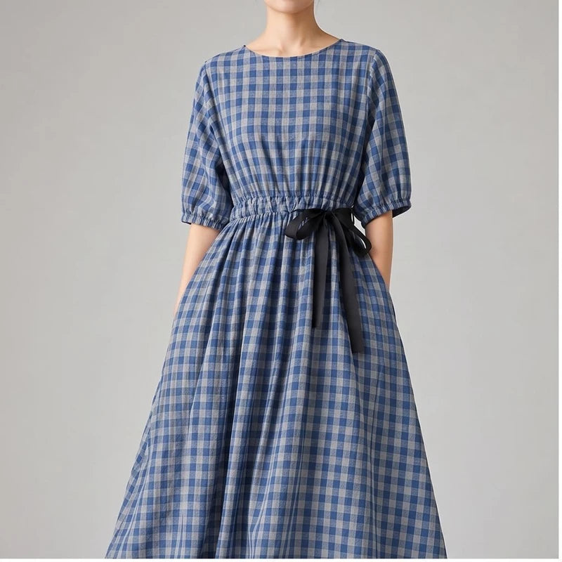 Model wearing Blue Elara Check Midi Dress in studio