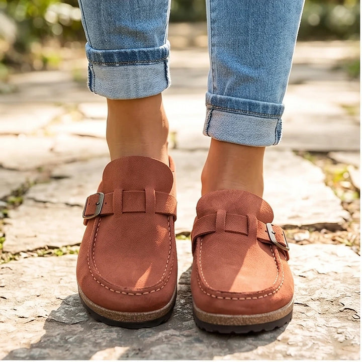 Model wearing Orange 2026 New Women's Shoes Slip on Female Flats Durable Belt Buckles Mules Fashion Wear Resistant Women Half Slippers Retro Zapatos outdoors
