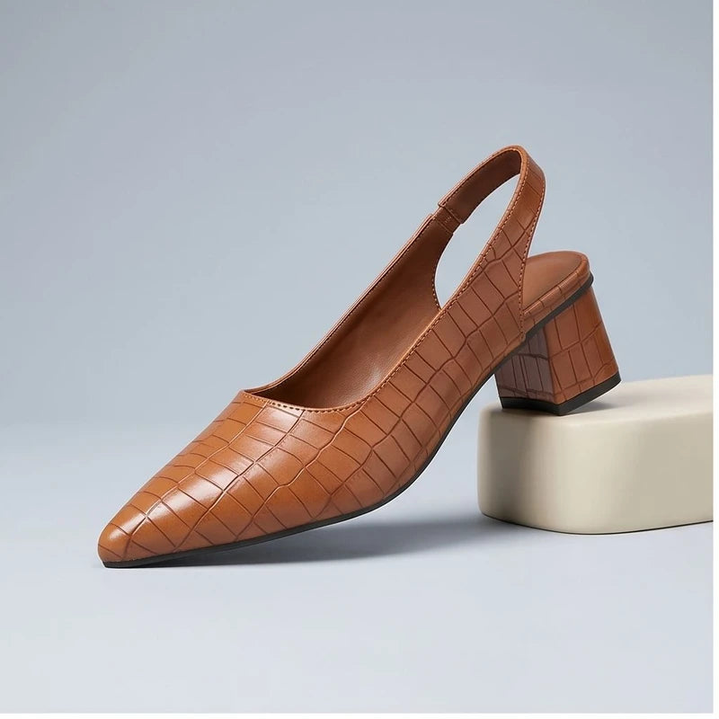 Brown heels in a studio background