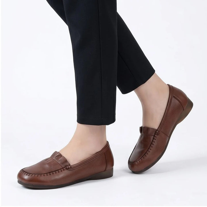 Model wearing Brown leather loafers in a studio - 2