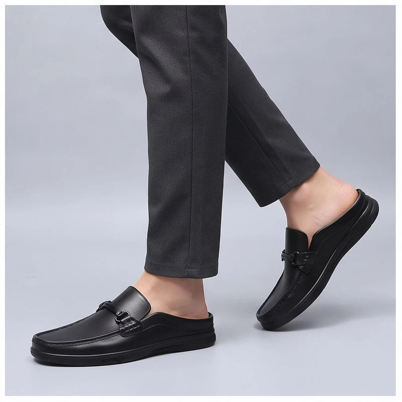 Model wearing Black leather mules in a studio - 2