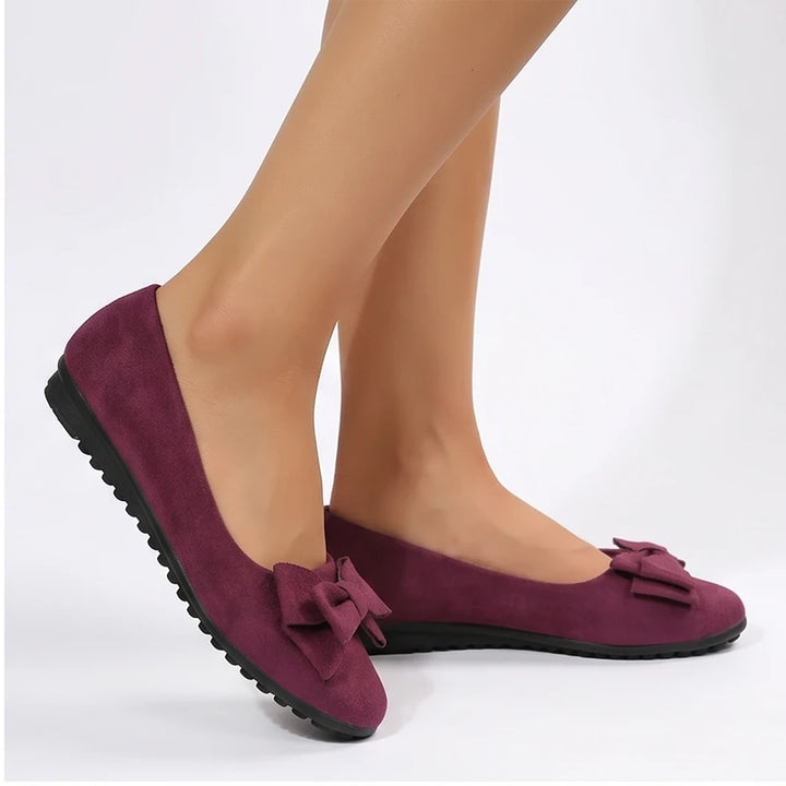 Model wearing Red Briony Suede Bow Flats in studio - 2
