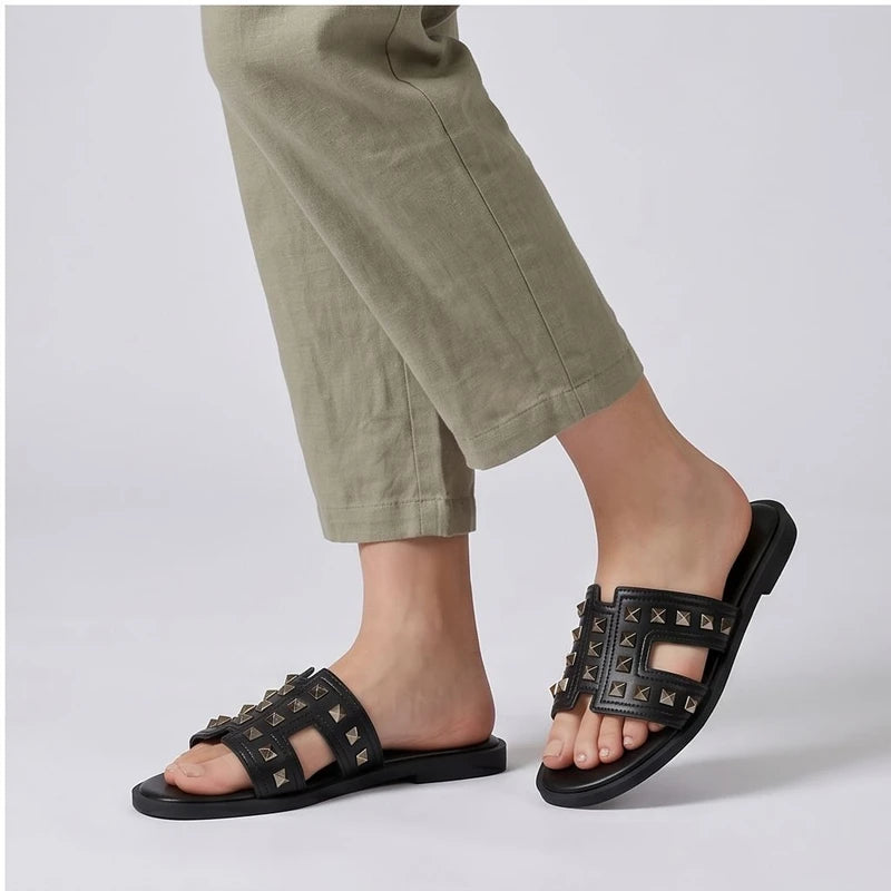 Bellamy black studded leather slide sandals.