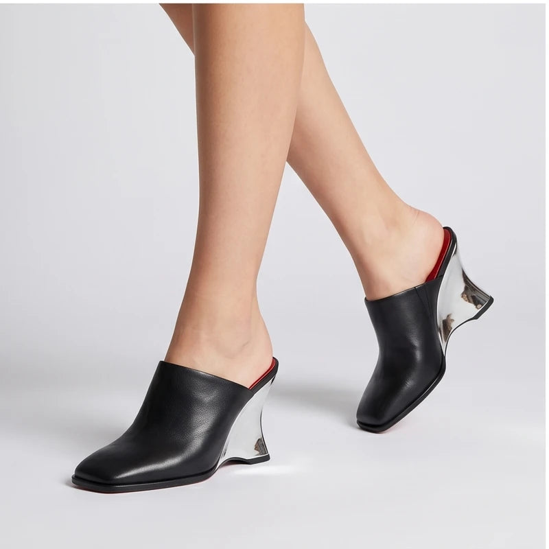 Model wearing Black Olympia Genuine Cowhide Leather Heeled Mules in studio - 3