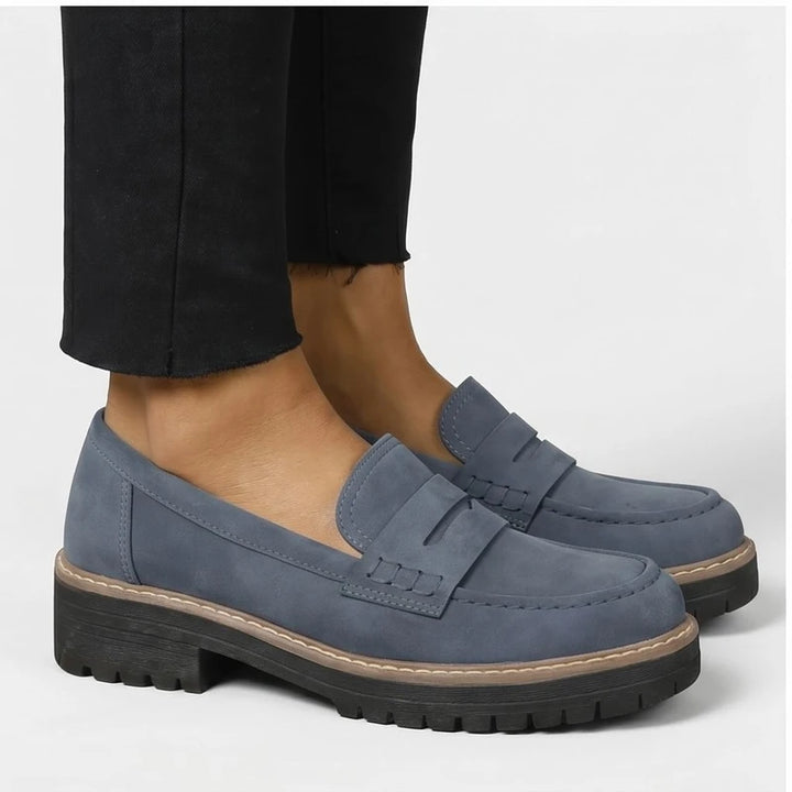 Model wearing Blue Brynn Suede Penny Loafers  [needs new images] in studio - 2