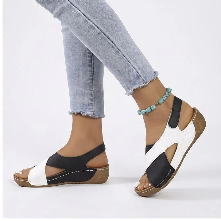 Model wearing Black sandals in a studio