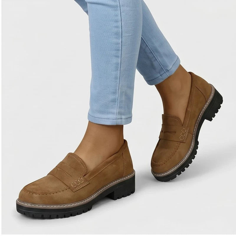 Model wearing Brown Brynn Suede Penny Loafers  [needs new images] in studio
