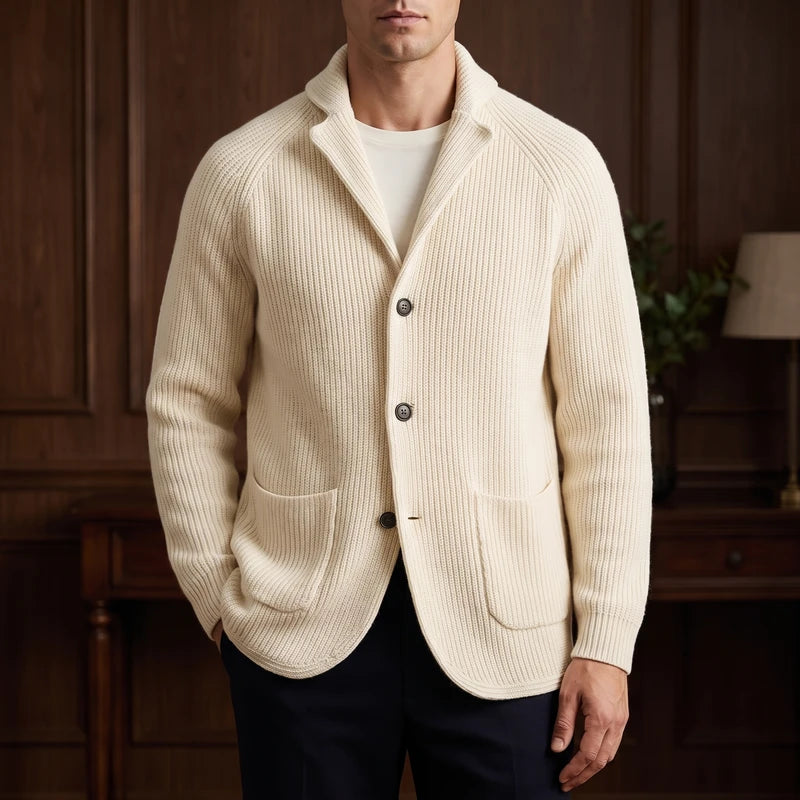 Beige knit cardigan in a dark wood interior