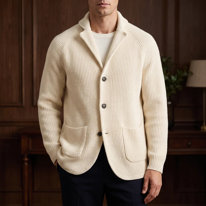 Beige knit cardigan in a dark wood interior