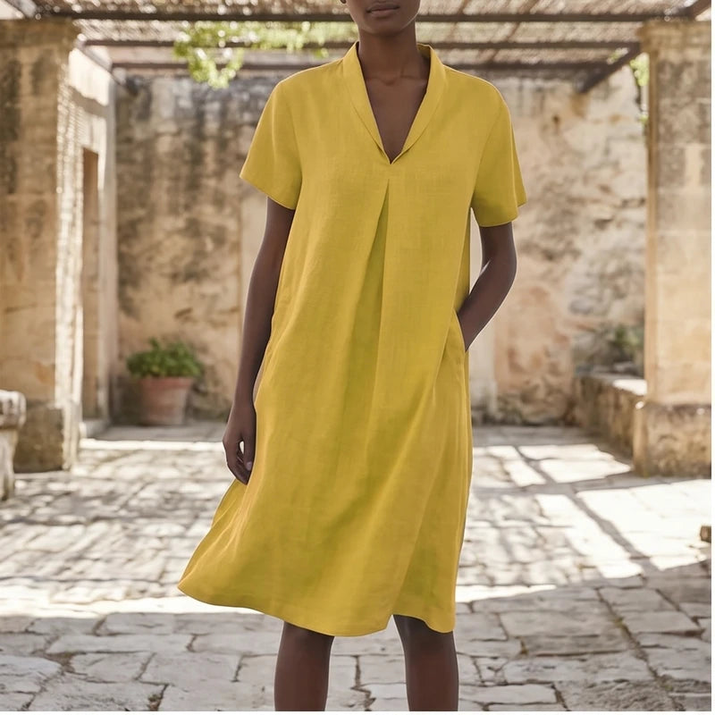Model wearing Yellow Women's Short-sleeved Cotton and Linen Dress V-neck Loose Large Size Casual Vacation Street Long Dress with Pockets outdoors
