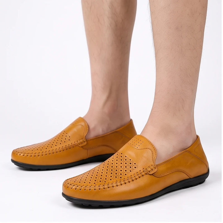 Model wearing Tan leather loafers in a studio