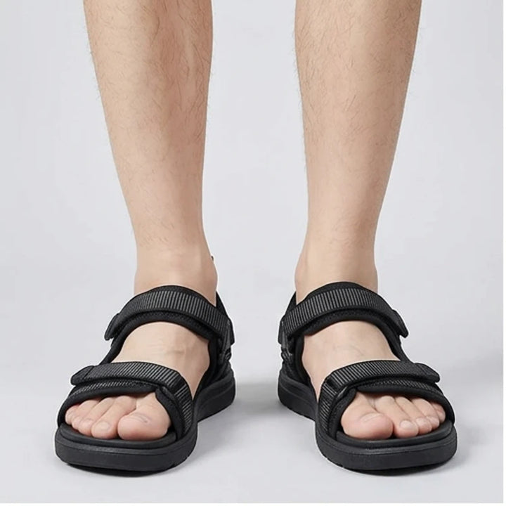 Model wearing Black Ashford Sport Sandals in studio