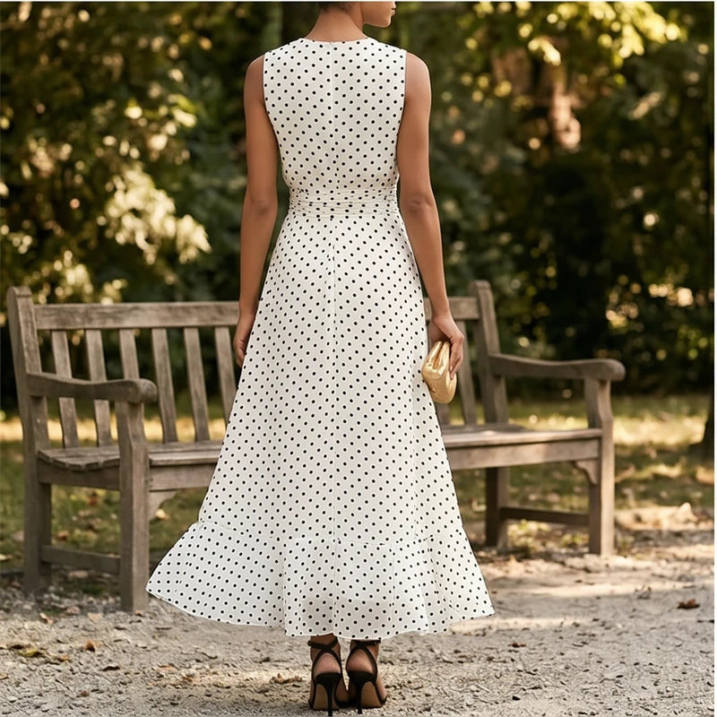 Model wearing White Sleeveless Polka Dot Chiffon Maxi Dress with Ruffle Hem and Flowing A Line Silhouette for Summer Parties outdoors - 2