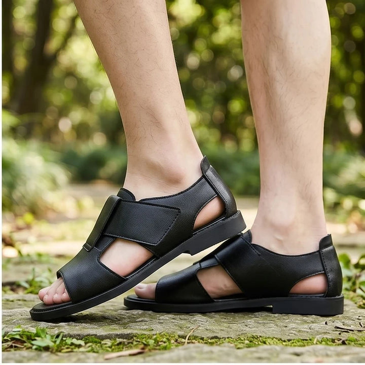 Model wearing black Kestrel Genuine Leather Gladiator Sandals outdoors - 2