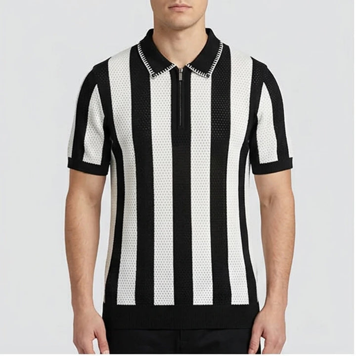 Model wearing Black Corbin Cotton Knit Polo Shirt in studio