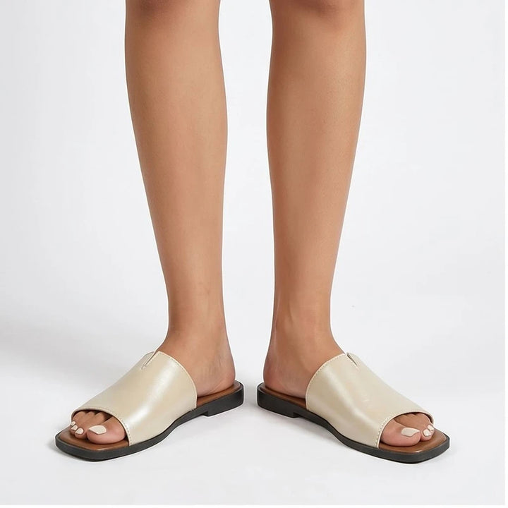 Model wearing Beige Shiny Metallic Flat Slides for Women Square Toe Open Toe Lightweight Comfortable Summer Beach Casual Daily Walking Shoes in studio