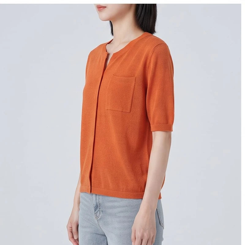Model wearing Orange cardigan in a studio - 2